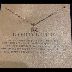 Gold elephant necklace with cute gold paper.